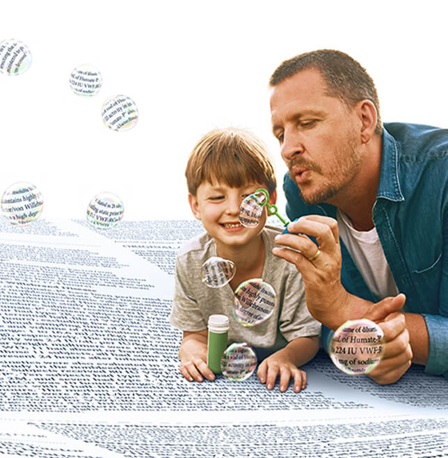 man and child blowing bubbles